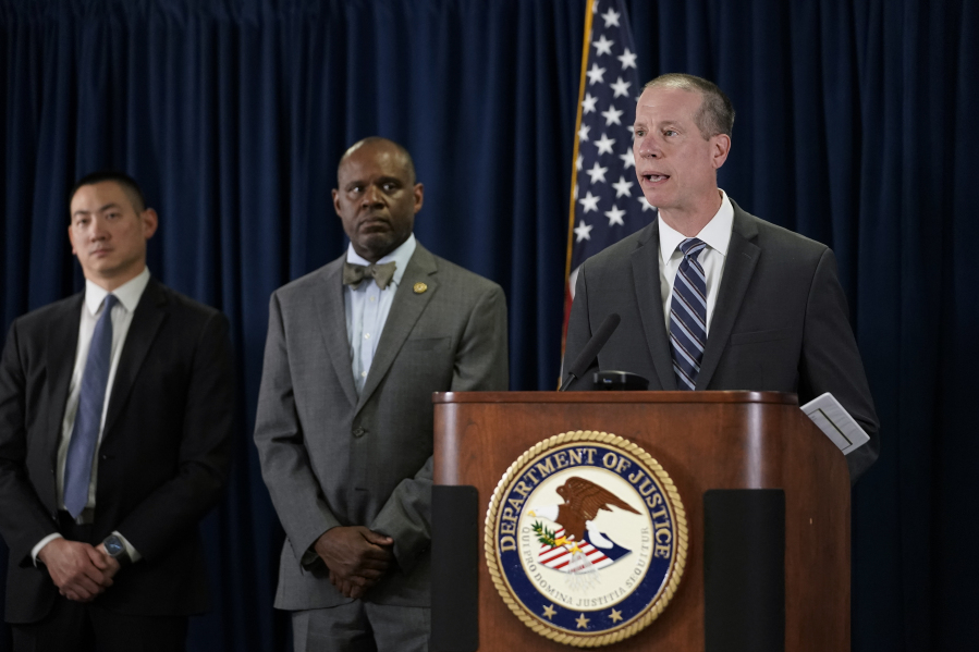 Robert Tripp, special agent in charge of the FBI's San Francisco Field Office, right, speaks to reporters during a press conference to announce federal authorities have charged 10 current and former Northern California police officers in a corruption investigation Thursday, Aug. 17, 2023, in San Francisco. Arrest warrants were served Thursday in California, Texas and Hawaii. (AP Photo/Godofredo A.