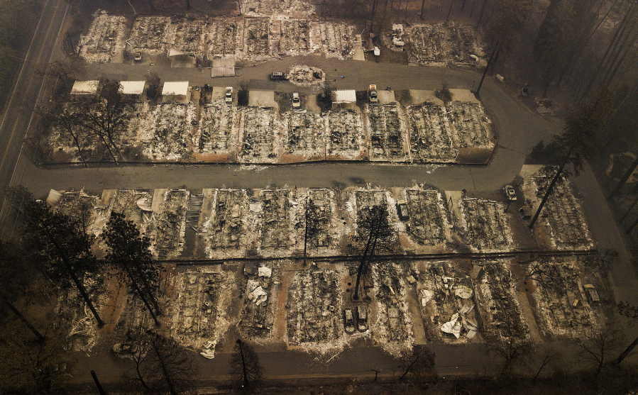 FILE - Residences leveled by a wildfire in Paradise, Calif., are seen on Nov. 15, 2018. Officials in Paradise began testing a new wildfire siren system this summer as the five-year anniversary of the deadly and devastating wildfire approaches. Reliable warning systems are becoming more critical during wildfires, especially as power lines and cell towers fail, knocking out communications critical to keeping people informed.