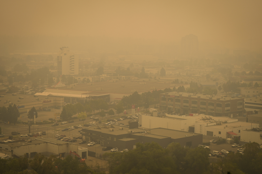 Smoke from wildfires fills the air in Kelowna, British Columbia, Saturday, Aug. 19, 2023.