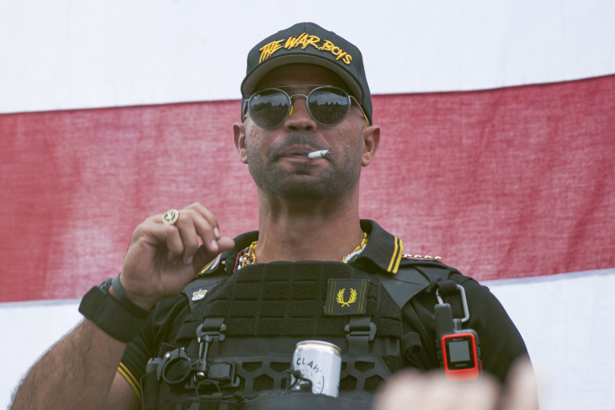 FILE - Proud Boys leader Henry "Enrique" Tarrio wears a hat that says The War Boys during a rally in Portland, Ore., on Sept. 26, 2020. The Justice Department said Thursday, Aug. 17, 2023, it is seeking 33 years in prison for Tarrio, convicted of seditious conspiracy in one of the most serious cases to emerge from the Jan. 6, 2021, attack on the U.S. Capitol.