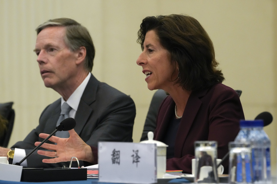 U.S. Commerce Secretary Gina Raimondo, right, speaks next to U.S. Ambassador to China Nick Burns during a meeting with Chinese Minister of Commerce Wang Wentao at the Ministry of Commerce in Beijing, Monday, Aug. 28, 2023.