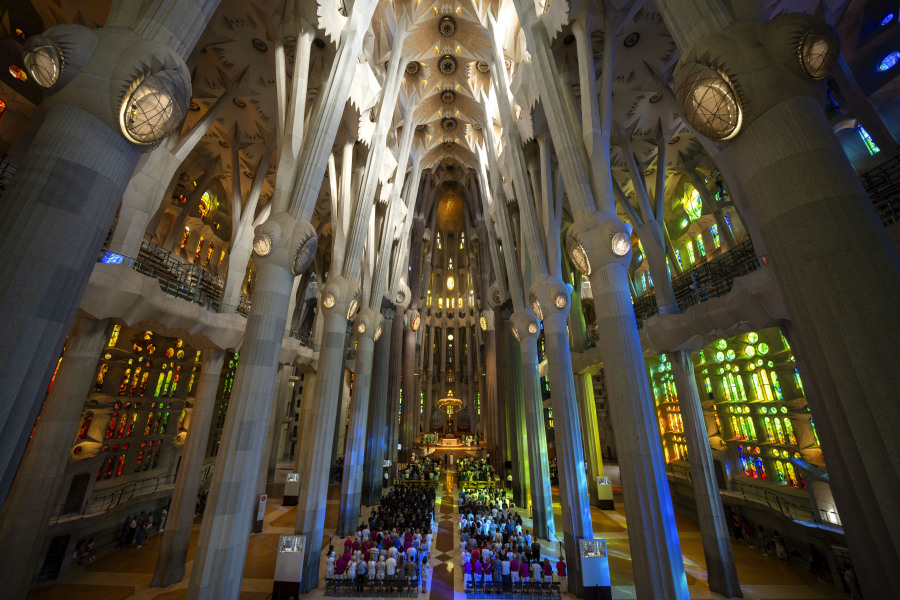 Worshippers attend a Mass July 9 in the Sagrada Familia basilica in Barcelona, Spain. With tourism reaching or surpassing pre-pandemic levels across southern Europe this summer, iconic sacred sites struggle to find ways to accommodate both the faithful who come to pray and millions of increasingly secular visitors attracted by art and architecture.