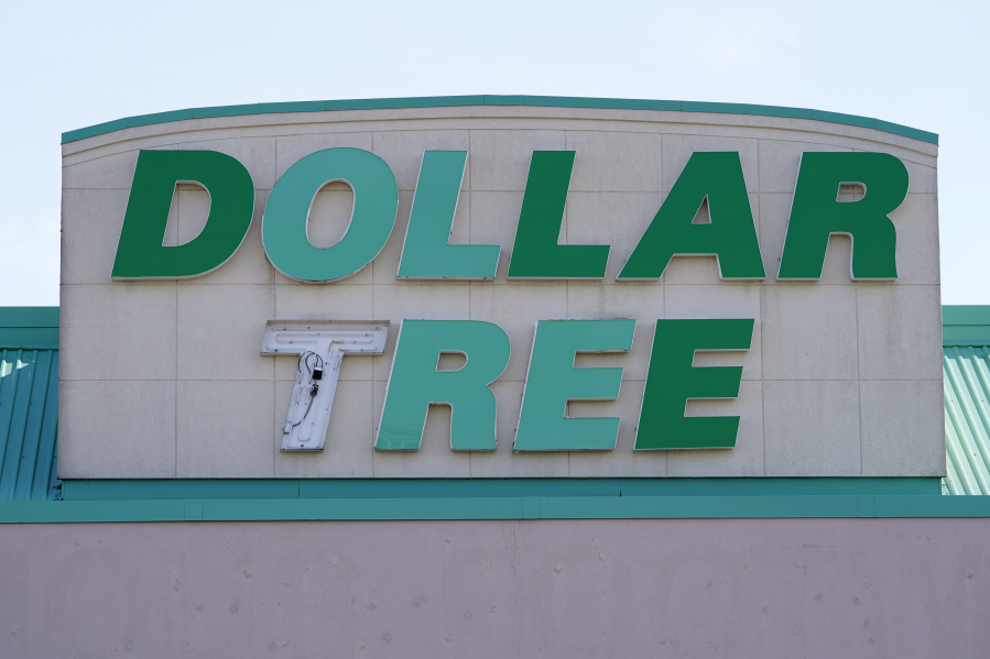 FILE - A sign hangs above a Dollar Tree store in Des Moines, Iowa. U.S. regulators on Wednesday, Aug. 23, 2023, have announced a settlement with the company that runs Dollar Tree and Family Dollar aimed at improving worker safety at thousands of the bargain stores across the country.