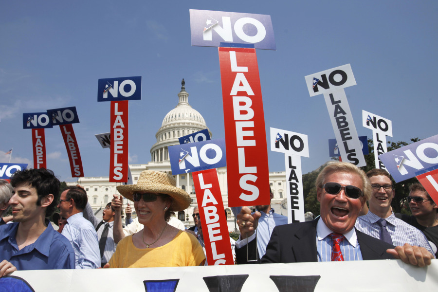 FILE - John Holman, of Denver, Colo., right, and others with the group "No Labels" take part in a rally on Capitol Hill in Washington, July 18, 2011. North Carolina voters could have another presidential ticket to choose from in 2024 now that state election officials have formally granted the "No Labels" movement a spot on the ballot. The State Board of Elections voted 4-1 on Sunday, Aug. 13, 2023, to recognize the No Labels Party as an official North Carolina party following a successful petition effort.