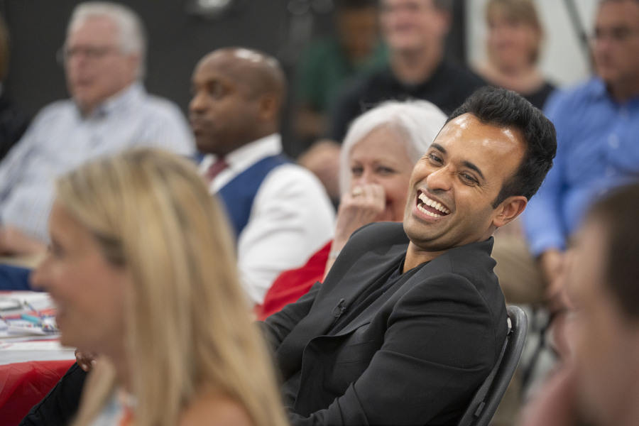 Republican presidential hopeful Vivek Ramaswamy laughs at a joke during the Polk County Summer Sizzle fundraising event in Clive, Iowa, Friday, Aug. 25, 2023.