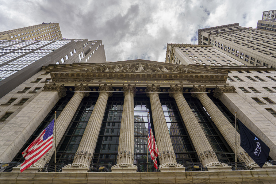 Storm clouds form above the New York Stock Exchange building in New York City, Tuesday, Aug. 8, 2023. Stocks are tumbling as worries about the banking system and the global economy inject more caution into financial markets worldwide. (AP Photo/J.