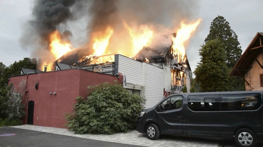 Fire rages at a vacation home in the town of Wintzenheim, north-eastern France, Wednesday Aug. 9, 2023. A fire ripped through a vacation home for adults with disabilities in eastern France on Wednesday, killing several people, the head of rescue operations said.