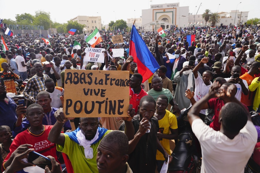 FILE - Nigeriens participate in a march called by supporters of coup leader Gen. Abdourahmane Tchiani in Niamey, Niger, Sunday, July 30, 2023. The French Foreign Ministry says Tuesday, Aug.1, 2023 France is planning an imminent evacuation of people seeking to leave Niger after the coup last week in the former French colony.