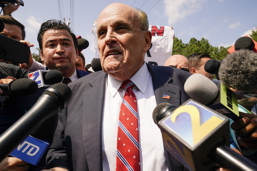 Rudy Giuliani speaks outside the Fulton County jail, Wednesday, Aug. 23, 2023, in Atlanta. Giuliani has surrendered to authorities in Georgia to face an indictment alleging he acted as former President Donald Trump's chief co-conspirator in a plot to subvert the 2020 election.