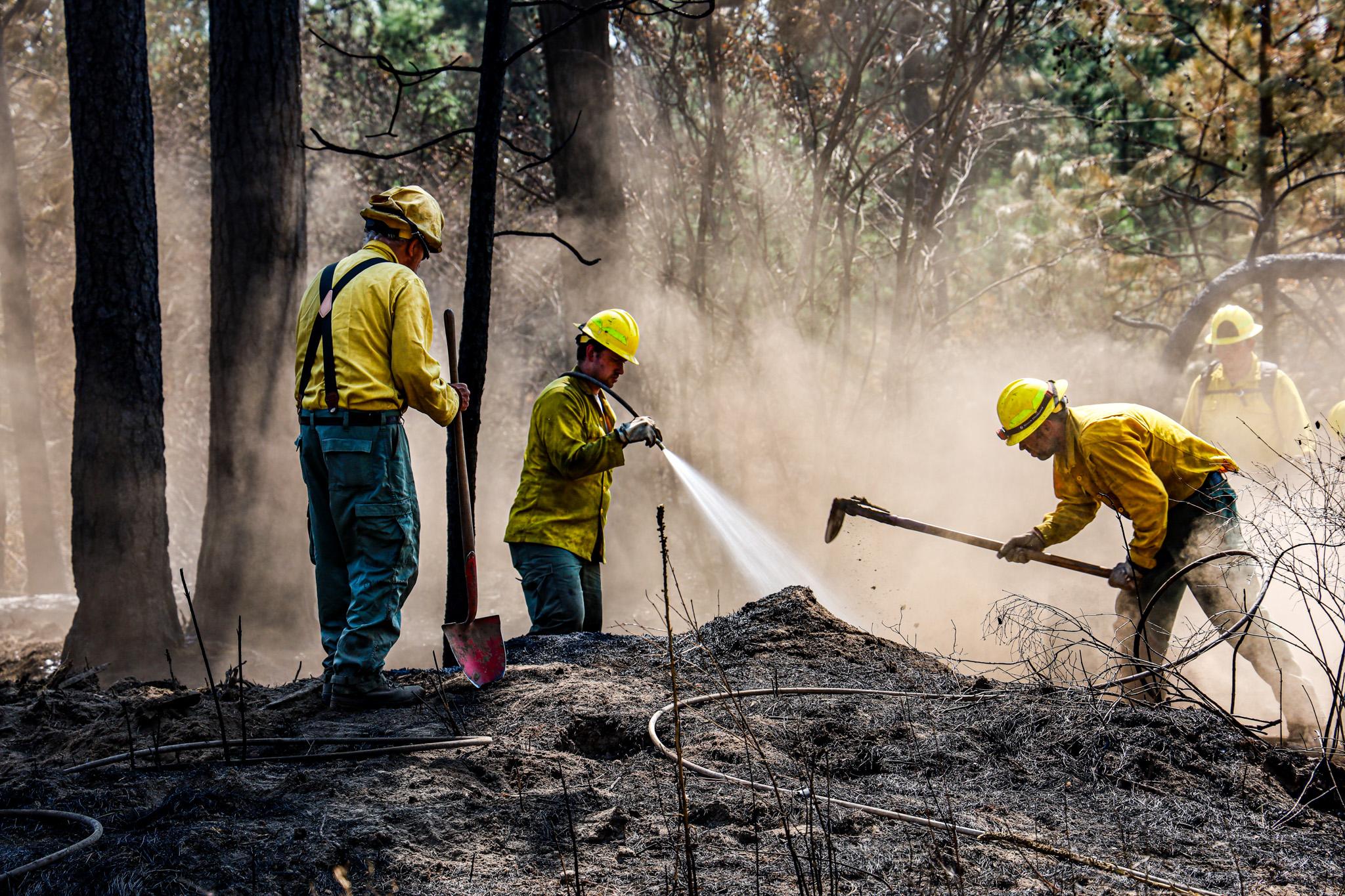 A Mason County strike team works on mopping up in the Gray Fire area in eastern Washington.