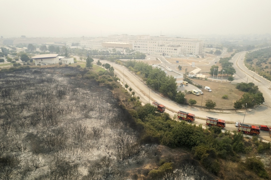 Burnt trees are seen from above near the hospital in the town of Alexandroupolis, in the northeastern Evros region, Greece, Tuesday, Aug. 22, 2023. Hundreds of firefighters struggled Tuesday to control major wildfires burning out of control for days in northeastern Greece and on Tenerife in Spain's Canary Islands, with strong winds fanning the flames and prompting evacuations of villages and a city hospital in Greece.