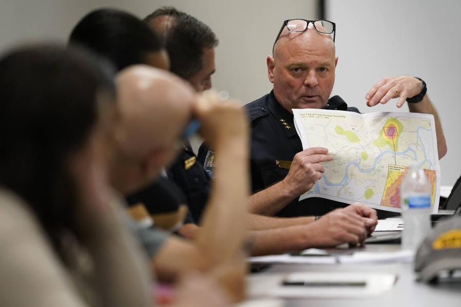 Knoxville Deputy Police Chief Tony Willis uses a map to show the concentration of gun violence crimes during a meeting of the Violence Reduction Leadership Committee on Thursday, Aug. 3, 2023, in Knoxville, Tenn. The city saw a spike in gun deaths in 2020 and 2021, with a gun homicide rate that at one point in 2021 rivaled Chicago's.