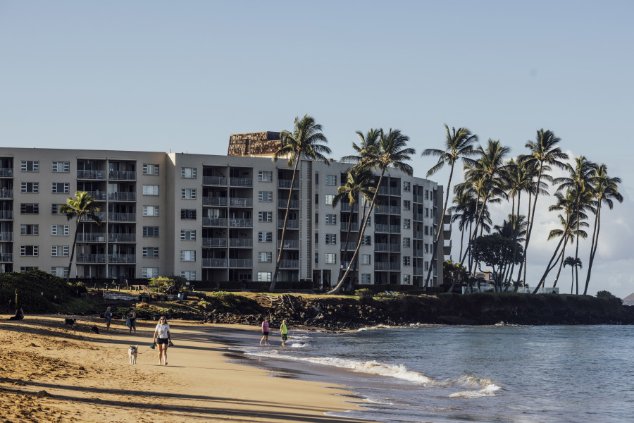 Beachgoers are seen at Kamaole Beach Park I in Kihei on the island of Maui, Hawaii Friday, Aug.