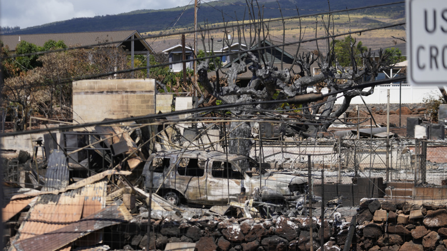 Destruction is seen in a neighborhood, Sunday, Aug. 13, 2023, in Lahaina, Hawaii, following a deadly wildfire that caused heavy damage days earlier.
