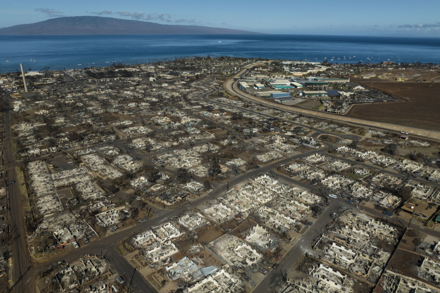 FILE - The aftermath of a wildfire is visible in Lahaina, Hawaii, Aug. 17, 2023. When the most deadly U.S. fire in a century ripped across the Hawaiian island, it damaged hundreds of drinking water pipes, resulting in a loss of pressure that likely allowed toxic chemicals along with metals and bacteria into water lines. Experts are using strong language to warn Maui residents in Lahaina and Upper Kula not to filter their own tap water. (AP Photo/Jae C.