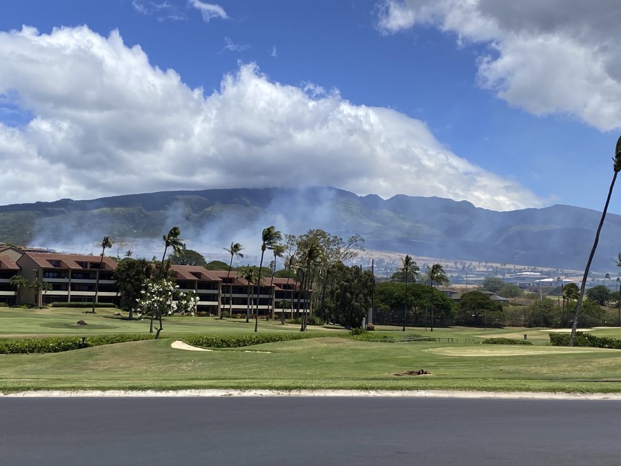 Smoke rises in the hills above the Kaanapali resort hotel area of Lahaina, Hawaii on Saturday, August 26, 2023. A brush fire on Saturday prompted Maui authorities to evacuate residents from a neighborhood of Lahaina, just a few miles from the site recently ravaged by blazes.