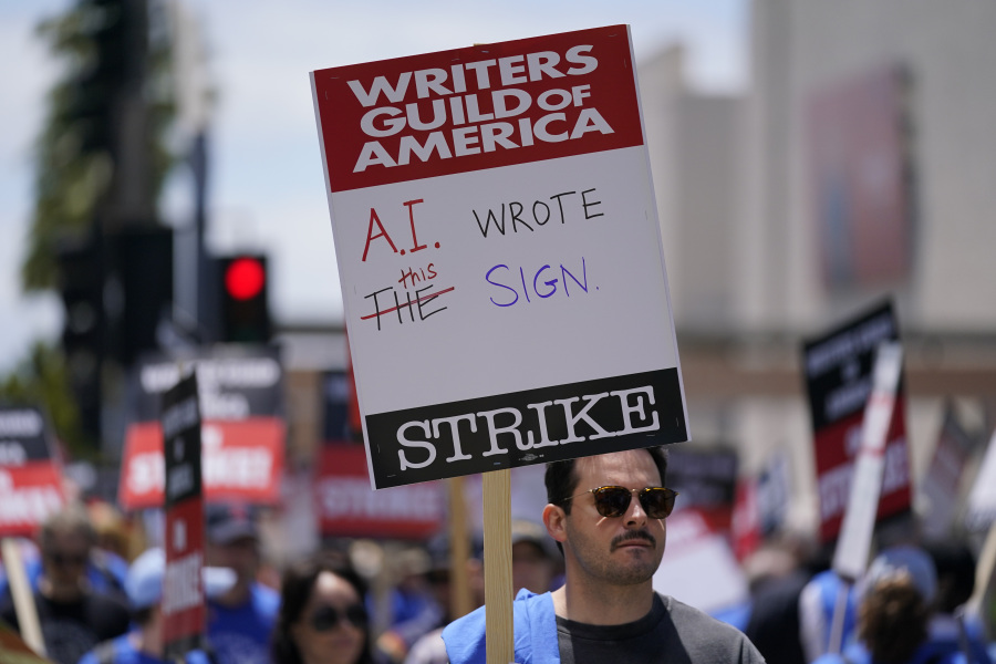 FILE - Members of the The Writers Guild of America picket outside Fox Studios on Tuesday, May 2, 2023, in Los Angeles. Getting control of the use of artificial intelligence is a central issue in the current strikes of Hollywood's actors and writers, which on Friday, July 21, 2023, entered its second week.