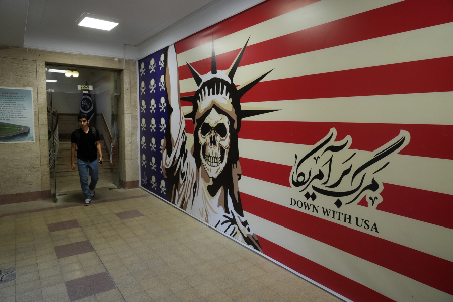 A man walks through the former U.S. Embassy, which has been turned into an anti-American museum in Tehran, Iran, on Saturday, Aug. 19, 2023. Seventy years after a CIA-orchestrated coup toppled Iran's Prime Minister Mohammad Mossadegh, its legacy remains contentious and complicated for the Islamic Republic as tensions stay high with the United States.