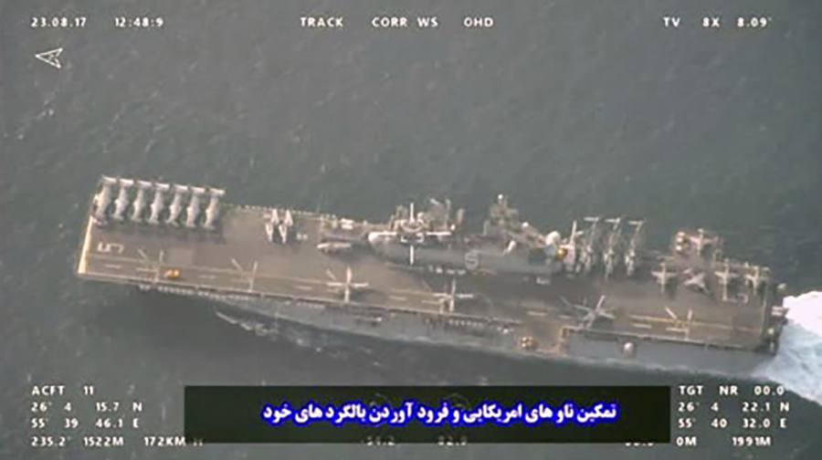 This image provided by the Iranian Revolutionary Guard via Tasnim News Agency on Sunday, Aug. 20, 2023, shows the USS Bataan at the Strait of Hormuz, in the mouth of the Persian Gulf.