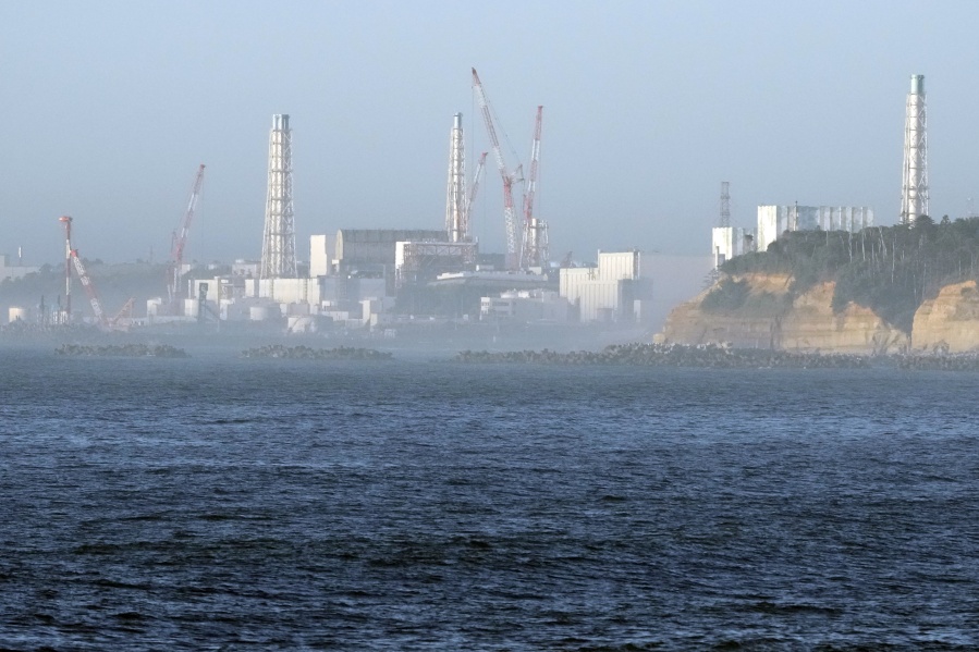The Fukushima Daiichi nuclear power plant, damaged by a massive March 11, 2011, earthquake and tsunami, is seen from the nearby Ukedo fishing port in Namie town, northeastern Japan, Thursday, Aug. 24, 2023. The Fukushima Daiichi nuclear power plant will start releasing treated and diluted radioactive wastewater into the Pacific Ocean as early as Thursday.