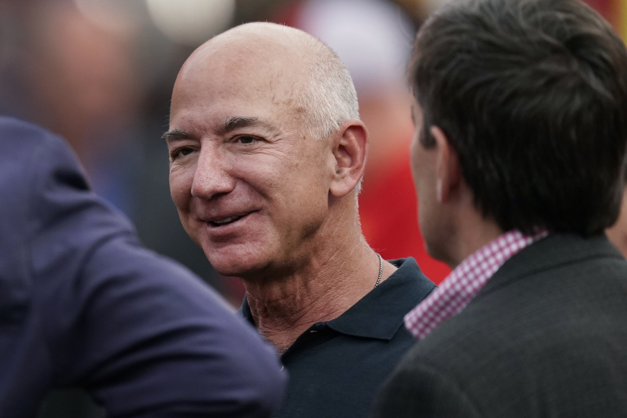 FILE - Amazon founder Jeff Bezos is seen on the sidelines before the start of an NFL football game, Sept. 15, 2022, in Kansas City, Mo.  The founder of Amazon is buying a home on an exclusive barrier island in Miami where he'll be neighbors with Tom Brady, Ivanka Trump and her husband, Jared Kushner.