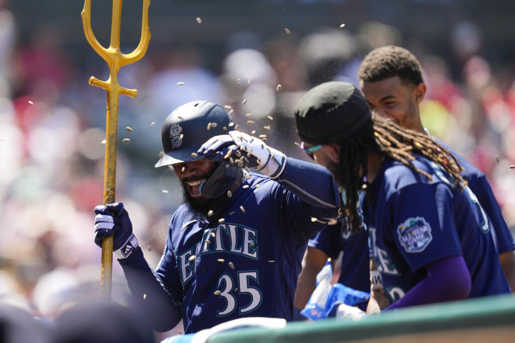 Seattle Mariners designated hitter Teoscar Hernandez (35) celebrates after hitting a home run during the seventh inning of a baseball game against the Los Angeles Angels in Anaheim, Calif., Sunday, Aug. 6, 2023.