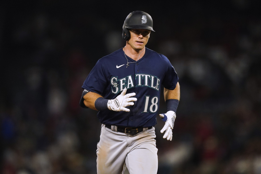 Seattle Mariners' Cade Marlowe runs the bases on a grand slam against the Los Angeles Angels during the ninth inning of a baseball game Thursday, Aug. 3, 2023, in Anaheim, Calif.
