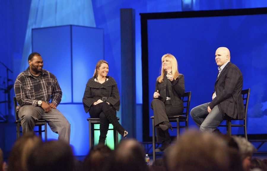 FILE - Michael Oher, left, Collins Tuohy, second from left, and Leigh Anne Tuohy, whose lives are portrayed in the Oscar-nominated movie "The Blind Side," speak with Pastor Kerry Shook, right, March 3, 2010 at Woodlands Church's Fellowship Campus in The Woodlands, TX. Michael Oher, the former NFL tackle known for the movie "The Blind Side," filed a petition Monday, Aug. 14, 2023, in a Tennessee probate court accusing Sean and Leigh Anne Tuohy of lying to him by having him sign papers making them his conservators rather than his adoptive parents nearly two decades ago. (AP Photo/The Courier, Eric S.
