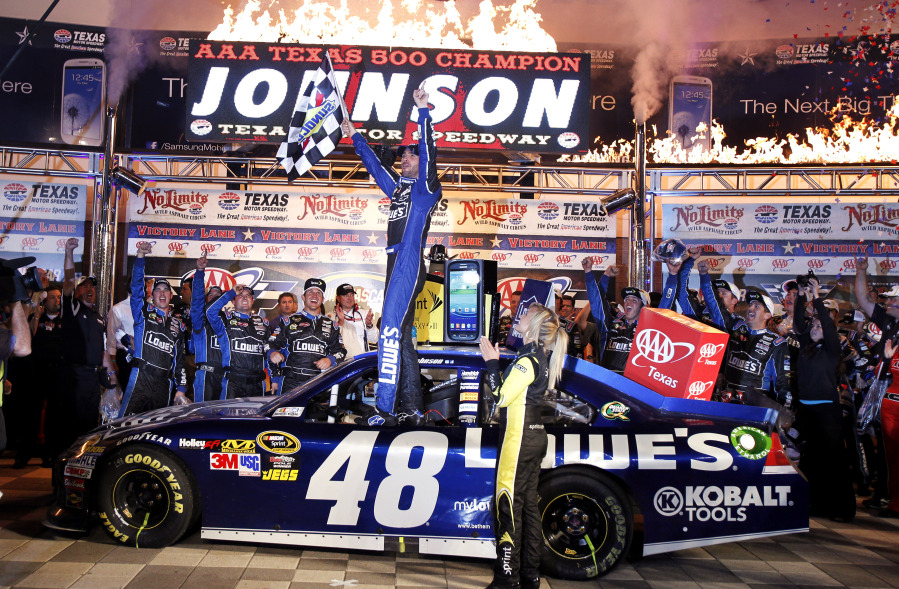 FILE - Jimmie Johnson (48) celebrates his win in a NASCAR Sprint Cup Series auto race at Texas Motor Speedway Sunday, Nov. 4, 2012, in Fort Worth. Seven-time Cup Series champion Jimmie Johnson and his former crew chief of the No. 48 Hendrick Motorsports Chevrolet Chad Knaus headline a list of 15 nominees for the NASCAR Hall of Fame Class of 2024.