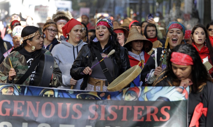 Women drummers sing as they lead a march during an Indigenous Peoples Day event Oct. 9, 2017, in Seattle. Members of the Native American Journalists Association are voting on whether to change the name to the Indigenous Journalists Association.