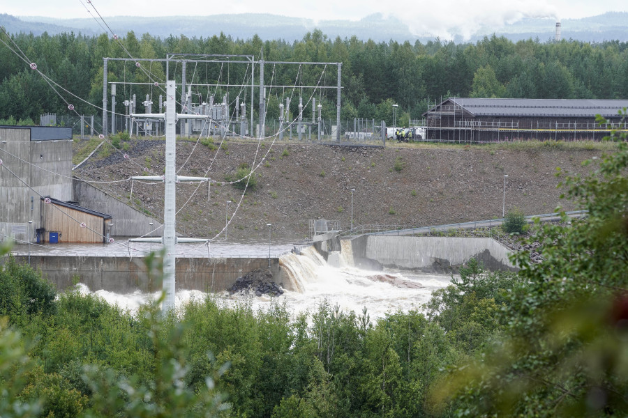 The Braskreidfoss Power plant is pictured in Braskereidfoss, Norway, Wednesday, Aug. 9, 2023. Authorities in Norway are considering blowing up a dam at risk of bursting after days of heavy rain to prevent downstream communities from getting deluged. The Glama, Norway's longest and most voluminous river, is dammed at the the Braskereidfoss hydroelectric power plant, which was under water and out of operation on Wednesday.