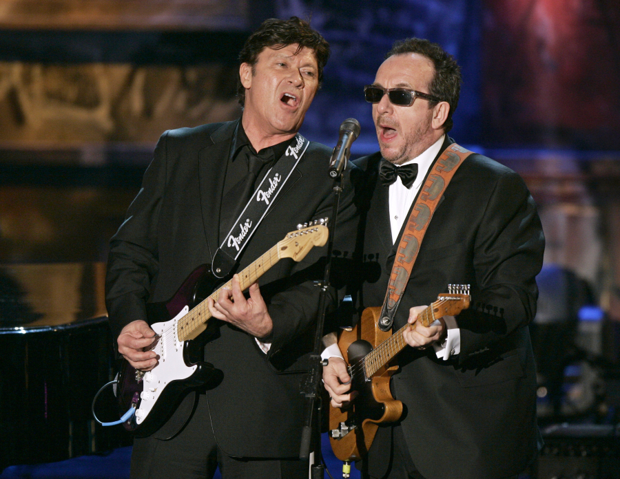 Robbie Robertson, left, and Elvis Costello play in an all-star tribute to New Orleans at the end of the Rock & Roll Hall of Fame induction ceremonies March 13, 2006, in New York.