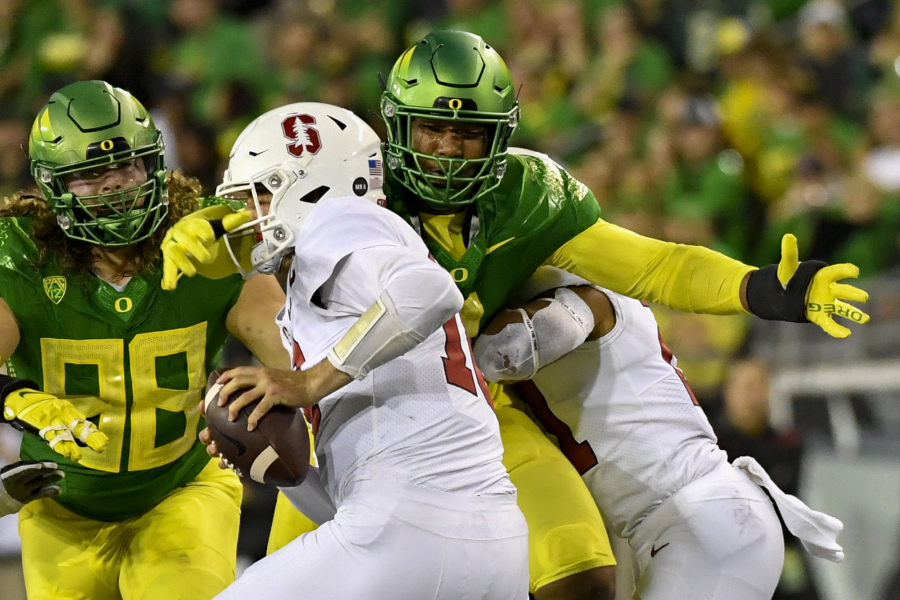 Oregon defensive end Brandon Dorlus (3) sacks Stanford quarterback Tanner McKee last season in Eugene, Ore. Oregon's fortunes will rest largely on its defense.