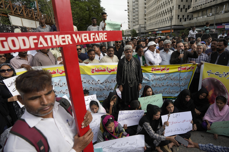Supporters of the National Christian Party hold a demonstration condemning the recent attack on a Christian area by an angry Muslim mob in Karachi, Pakistan, Thursday, Aug. 17, 2023. Police in eastern Pakistan arrested 129 Muslims overnight after a Muslim mob angered over an alleged desecration of the Quran attacked churches and homes of minority Christians, prompting authorities to summon soldiers to restore order, officials said.