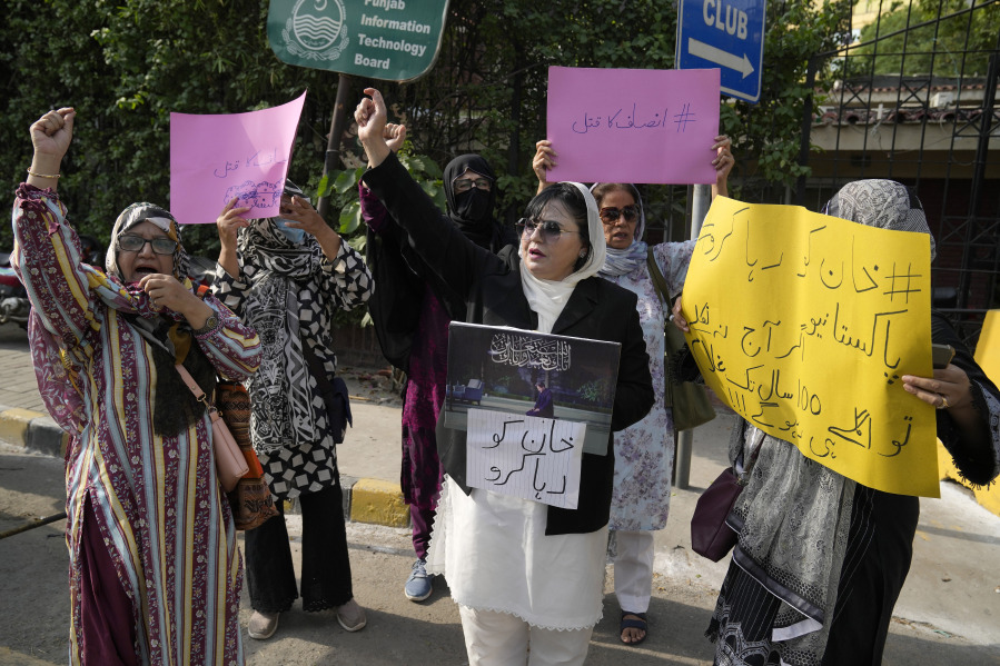 Supporters of Pakistan's former Prime Minister Imran Khan chant slogans during demonstration to condemn the arrest of their leader, in Lahore, Pakistan, Sunday, Aug. 6, 2023. Khan awoke Sunday as an inmate in a high-security prison after a court handed him a three-year jail sentence for corruption, a development that could end his future in politics. (AP Photo/K.M.