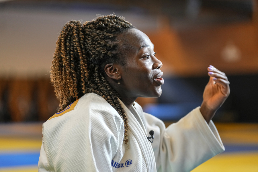 French judoka Clarisse Agbegnenou gestures during an interview with The Associated-Press in Paris, Wednesday, June 14, 2023. Breast-feeding and high-performance sports were long an almost impossible combination for women athletes, faced for decades with the cornelian choice of career or motherhood, because it was so tough to have both.