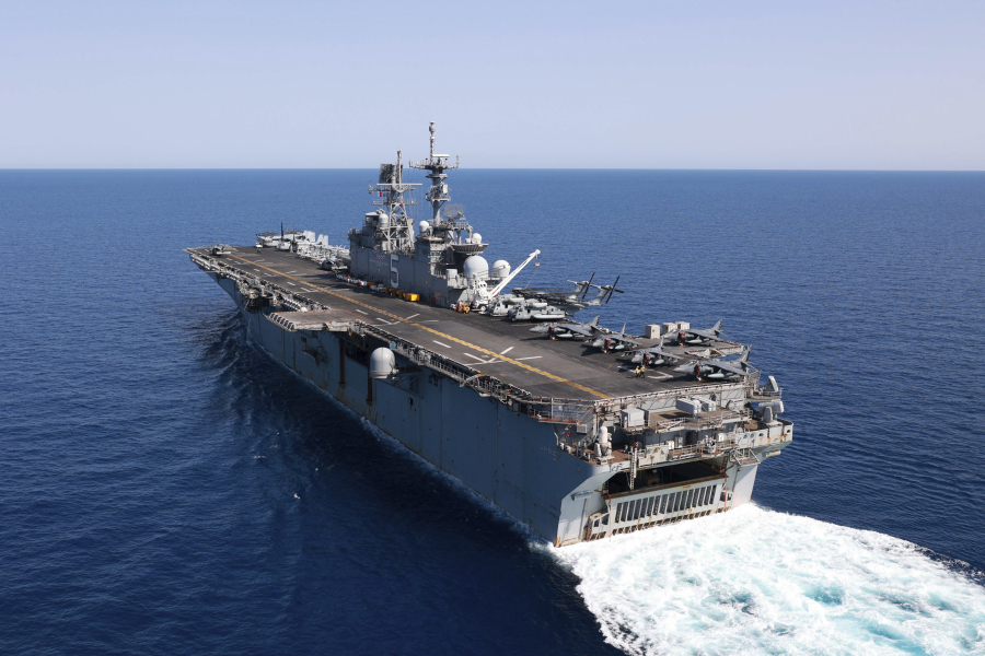 In this photo released by the U.S. Navy, the amphibious assault ship USS Bataan travels through the Red Sea, Tuesday, Aug. 8, 2023. Western-backed maritime forces in the Middle East on Saturday, Aug. 12,  warned shippers traveling through the strategic Strait of Hormuz to stay as far away from Iranian territorial waters as possible to avoid being seized, a stark advisory amid heightened tensions between Iran and the U.S. (Mass Communication Specialist 3rd Class Riley Gasdia/U.S.