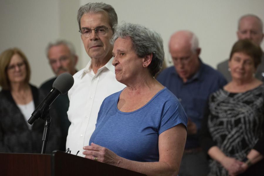Carol Black speak to the media as she is surrounded by other victims and families of victims of the Tree of Life mass shooting after the sentencing of Robert Bowers, at the Jewish Community Center in Pittsburgh, Wednesday, Aug 2, 2023. Bowers was sentenced to death for the 2018 killing of 11 people, including her brother Richard Gottfried, at the Tree of Life synagogue in Pittsburgh.