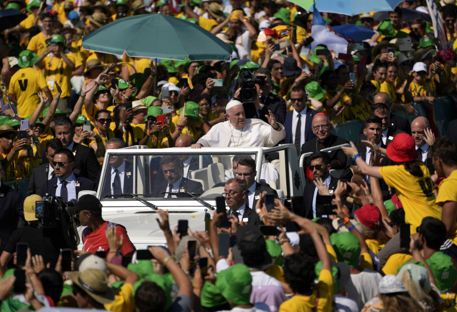Pope Francis greets about 30,000 international World Youth Day volunteers Sunday in Alg?s, just outside of Lisbon, Portugal.