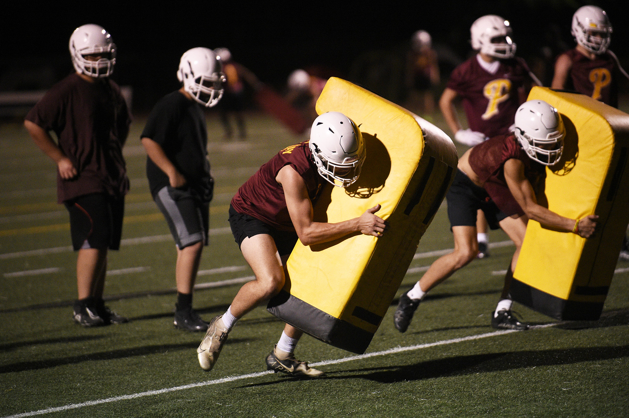 Prairie players go through a drill at the Falcons' midnight practice at Prairie High School on Wednesday, Aug. 16, 2023.