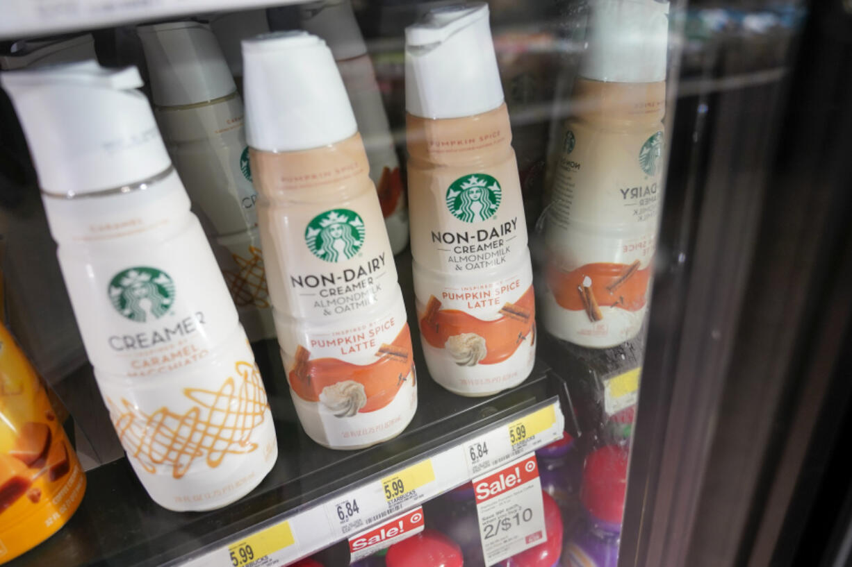 Starbucks' Pumpkin Spice Latte coffee creamers are displayed at a Target store, Wednesday, Aug. 23, 2023, in New York. The latte that made pumpkin spice a star is turning 20. And unlike the autumn days it celebrates, there seems to be no chill in customer demand. Starbucks' Pumpkin Spice Latte goes on sale Thursday in the U.S. and Canada. It's the coffee giant's most popular seasonal beverage, with hundreds of millions sold since its launch in 2003.