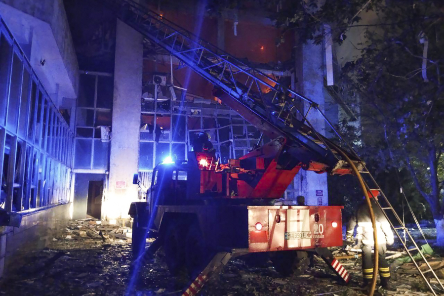In this photo provided by regional Governor Oleh Kiper rescuers work on a scene of drone attack in Odesa region, Ukraine, early Wednesday, Aug. 2, 2023.