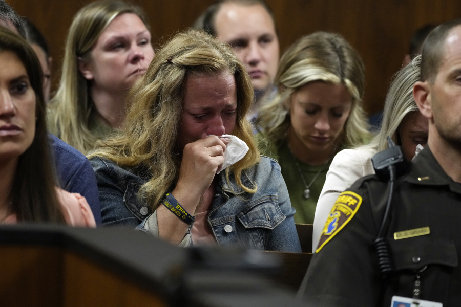 Sheri Myre, mother of slain Oxford student Tate Myre, weeps in court as the assistant principal at the school describes the shooting scene, Friday, July 28, 2023, in Pontiac, Mich. Prosecutors are making their case that the Michigan teenager should be sentenced to life in prison for killing four students at his high school in 2021. Prosecutors introduced dark journal entries written by Ethan Crumbley, plus chilling video and testimony from a wounded staff member.