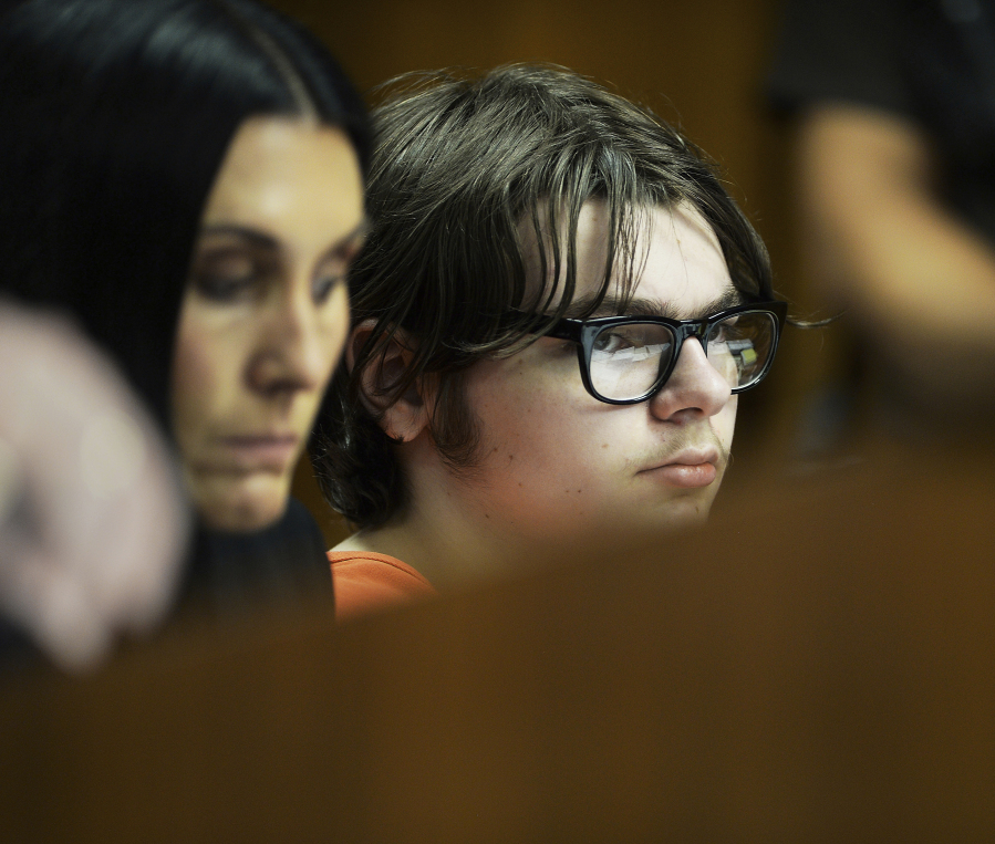 Ethan Crumbley, listens to testimony from Dr. Colin King, a psychologist, during his hearing at Oakland County Circuit Court Tuesday, Aug. 1, 2023, in Pontiac, Mich. The teenager killed four students at his Michigan high school in 2021. The psychologist testified Tuesday at the hearing to determine if Crumbley will get a life prison sentence.