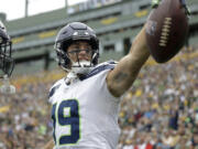 Seattle Seahawks wide receiver Jake Bobo celebrates after catching an 18-yard touchdown pass in the first half of a preseason NFL football game against the Green Bay Packers, Saturday, Aug. 26, 2023, in Green Bay, Wis.