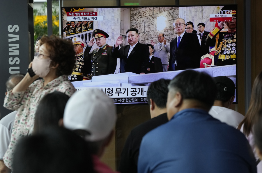 A TV screen shows an image of North Korean leader Kim Jong Un, center, at a military parade to mark the 70th anniversary of the armistice that halted fighting in the 1950-53 Korean War, during a news program at the Seoul Railway Station in Seoul, South Korea, Friday, July 28, 2023. Kim shared center stage with senior delegates from Russia and China as he rolled out his most powerful, nuclear-capable missiles in a military parade in the capital, Pyongyang, marking a major war anniversary with a show of defiance against the United States.