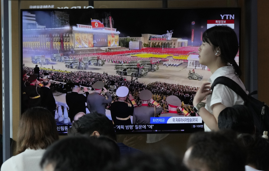 A TV screen shows an image of a military parade to mark the 70th anniversary of the armistice that halted fighting in the 1950-53 Korean War, during a news program at the Seoul Railway Station in Seoul, South Korea, Friday, July 28, 2023. North Korean leader Kim Jong Un shared center stage with senior delegates from Russia and China as he rolled out his most powerful, nuclear-capable missiles in a military parade in the capital, Pyongyang, marking a major war anniversary with a show of defiance against the United States.