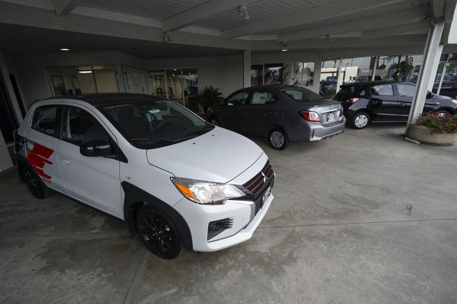 Three versions of the Mitsubishi Mirage sit for sale at El Cajon Mitsubishi on Aug. 8, 2023, in El Cajon, Calif. At a time when auto buyers increasingly want pricey SUVs and trucks and fewer want small cars, the Mirage remains the lone new vehicle whose average sale price is under 20 grand -- a figure that once marked a kind of unofficial threshold of affordability.