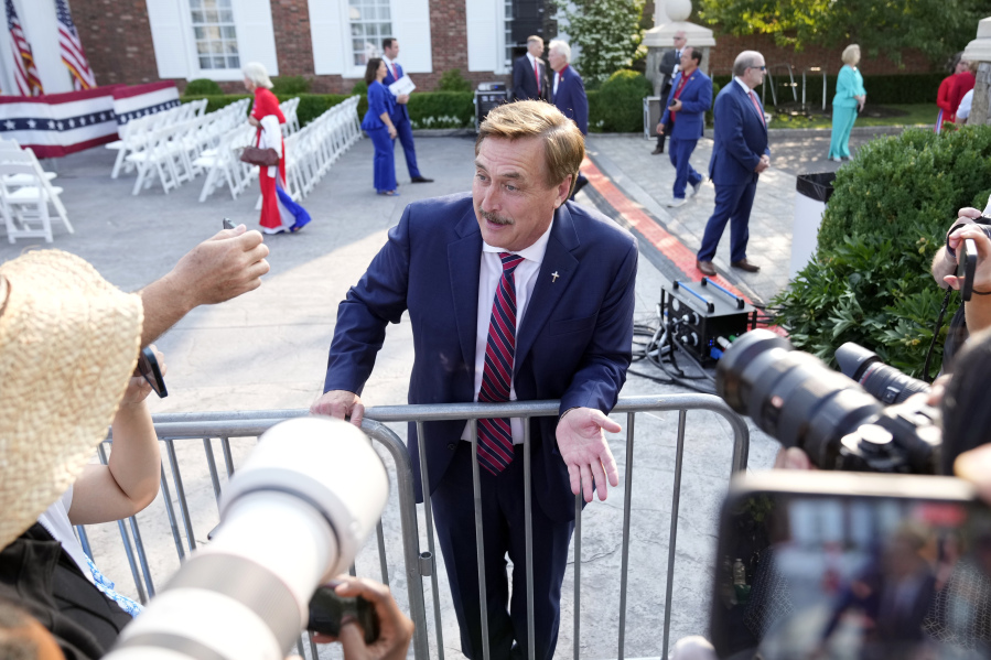 FILE - MyPillow CEO Mike Lindell talks to reporters before former President Donald Trump speaks at Trump National Golf Club in Bedminster, N.J., Tuesday, June 13, 2023, after pleading not guilty in a Miami courtroom earlier in the day to dozens of felony counts that he hoarded classified documents and refused government demands to give them back.