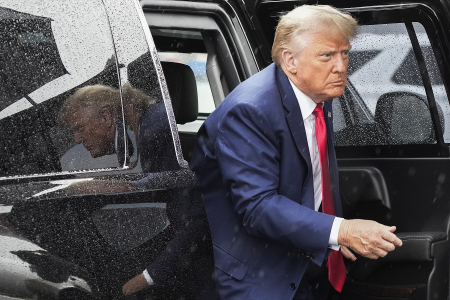 FILE - Former President Donald Trump arrives to board his plane at Ronald Reagan Washington National Airport, Aug. 3, 2023, in Arlington, Va., after facing a judge on federal conspiracy charges that allege he conspired to subvert the 2020 election. Trump and his legal team face long odds in their bid to move his 2020 election conspiracy trial out of Washington. They argue the Republican former president can't possibly get a fair trial in the overwhelmingly Democratic nation's capital.